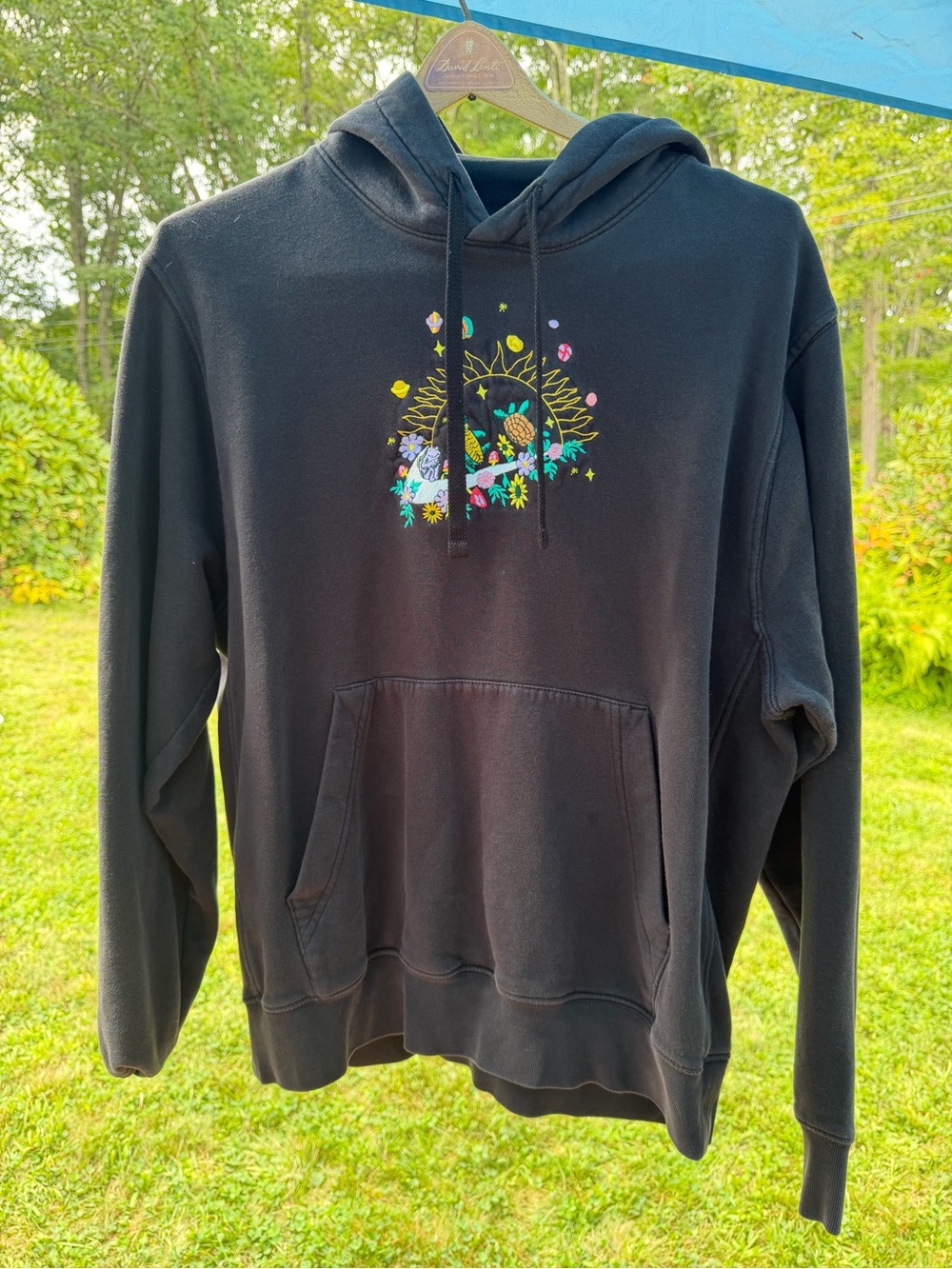 Black Nike Graphic Hooded Sweatshirt with Floral Sun Design